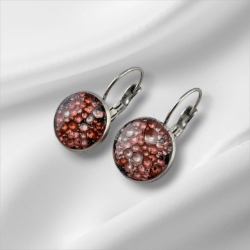 Epoxy oorbellen met een rode roze sparkling